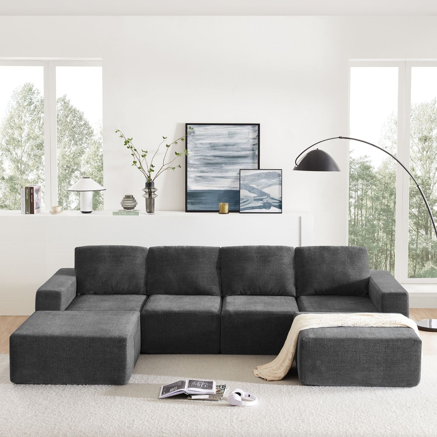 Dark gray luxury modular U-shaped sectional sofa with ottomans in modern living room