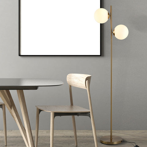 HOMCOM decorative floor lamp with two white glass globe shades and a gold metal body in a modern living room setting