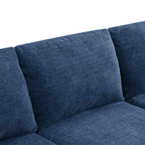 Close-up of navy blue chenille fabric cushions on luxury modular U-shape sectional sofa