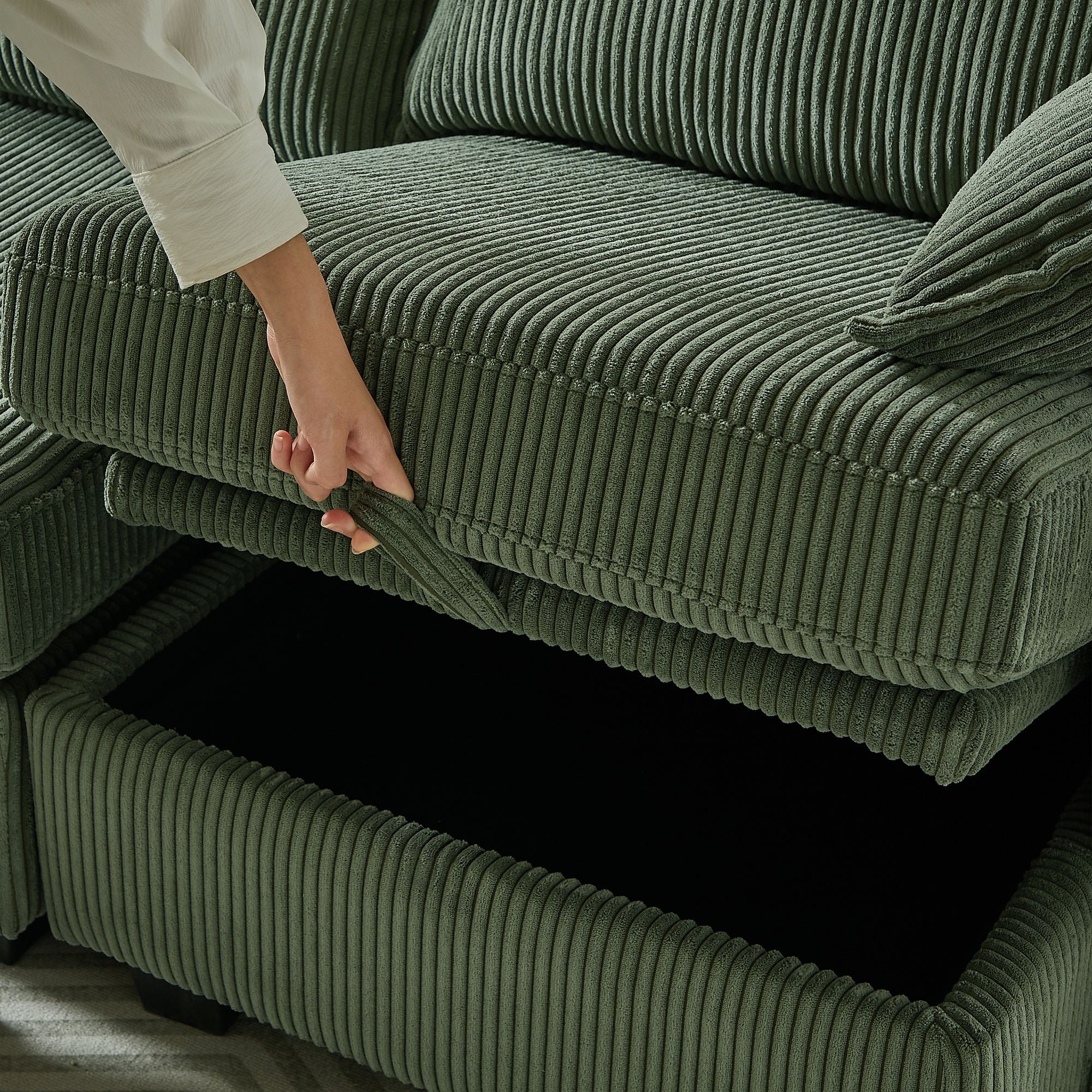 Green corduroy modular sectional sofa with storage ottoman and six seats in living room setup