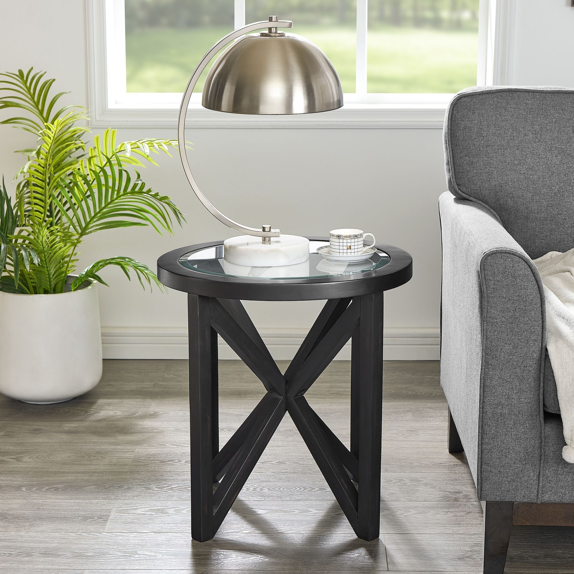 Modern simple glass round coffee table with tempered glass top and black wooden base for living room