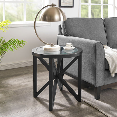 modern simple glass coffee table with round tempered glass top and black solid wood base in living room