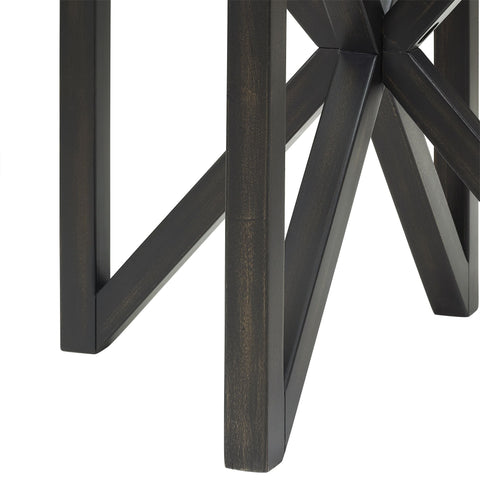 close-up of black solid wood base of modern simple glass coffee table