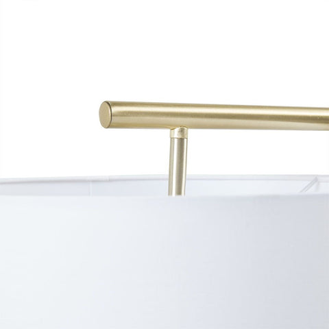 Close-up of gold-finished angular metal stand and white drum shade of Angular Arched Metal Floor Lamp
