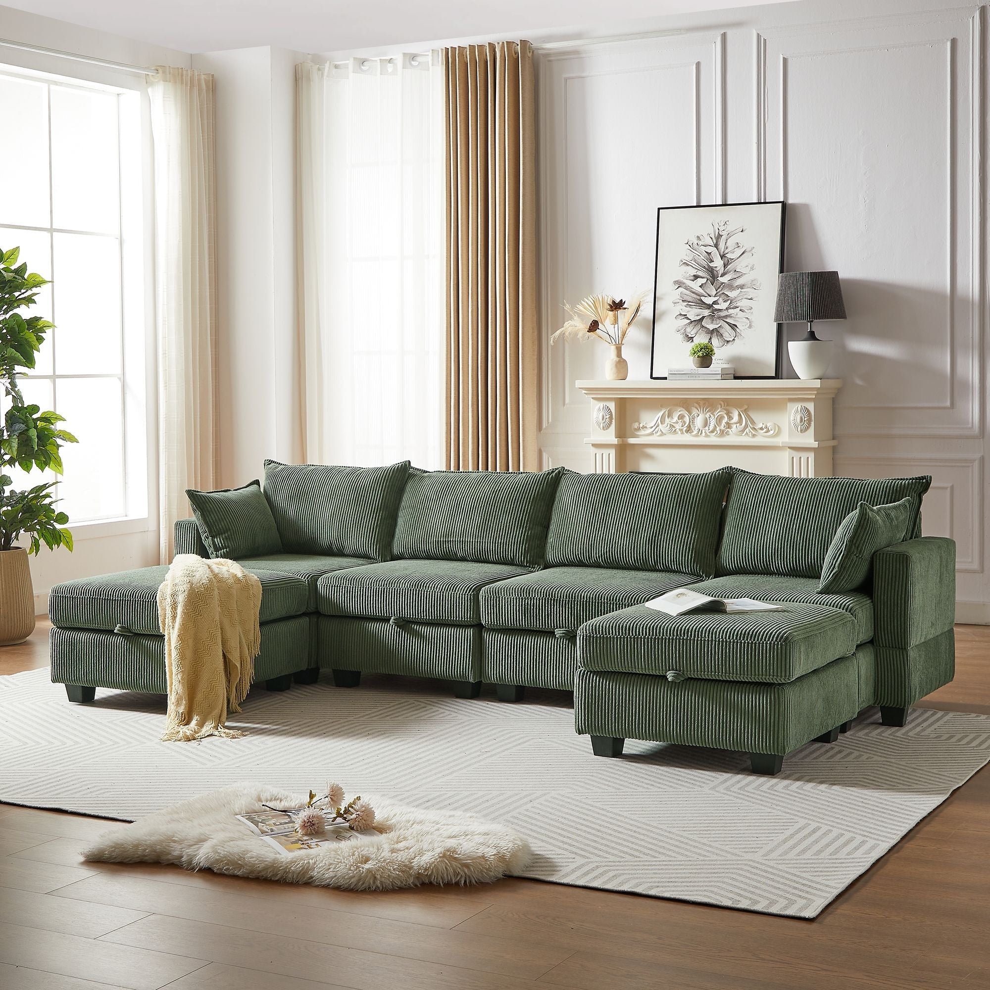 Green corduroy modular sectional sofa with chaise and storage ottoman in modern living room setting