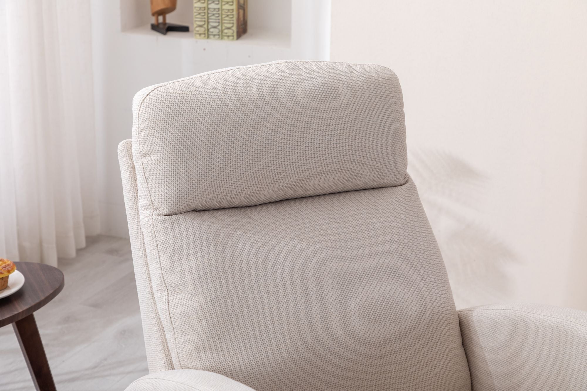 Beige COOLMORE Rocking Chair with high back, solid wood legs, cushioned seat, and side pocket in modern living room setting